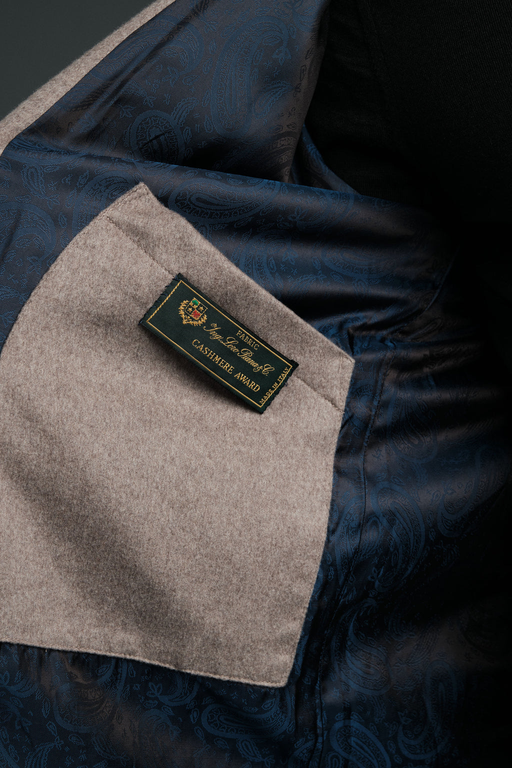 Close-up of a label on a piece of clothing with a dark background