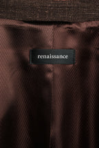 Close-up of a brown fabric with a 'renaissance' label.