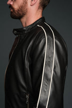 Black blown leather jacket with white stripes on a dark background