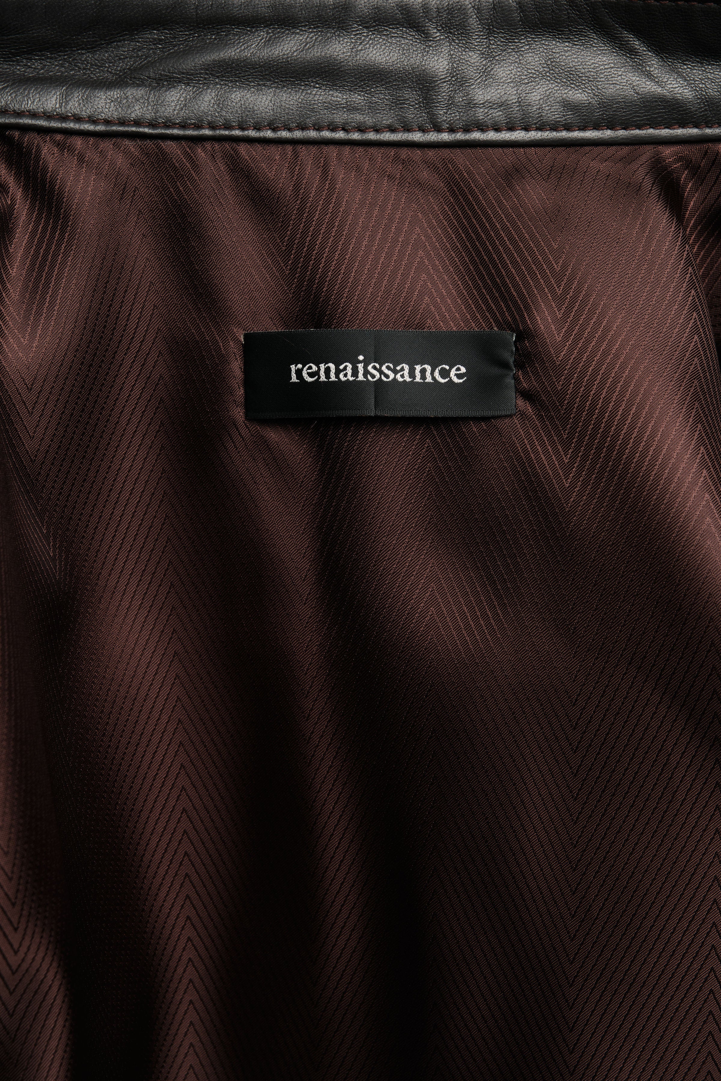 Close-up of a brown textured fabric with a 'renaissance' label.